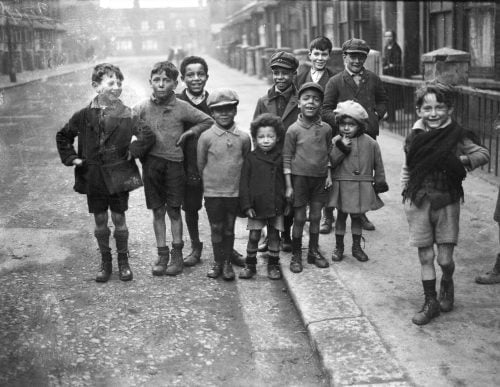 The original photo that appeared in the Daily Express’s ‘The Street of Hopeless Children’ article. Note how the white children, who had clearly been socialising with the others, had mostly been cropped out of the photo that appeared in the newspaper.