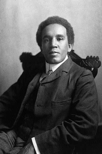 Photograph of Samuel Coleridge-Taylor sitting in a chair and looking at the camera