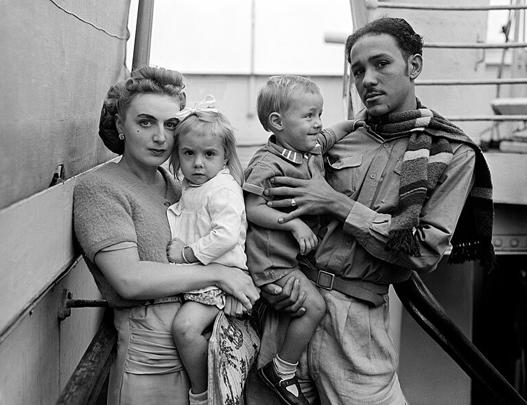 Doreen and Herbert Zayne on their arrival at Tilbury Dock on board the Empire Windrush, with their two young children.