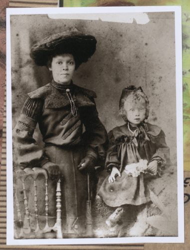 Photograph of two mixed race sisters, Eliza (standing) and Mabel (seated), taken in 1902.